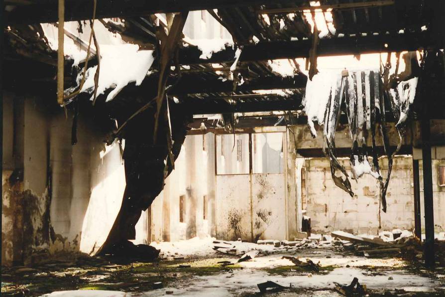Abandoned building, damaged beyond repair, along the main road from the airport to Sarajevo. December 1995.