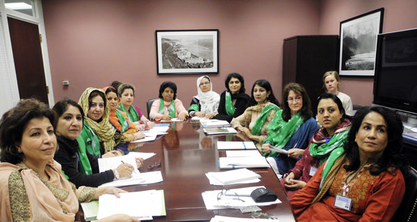 sarah-and-delegation A group of Pakistani women sitting around a table